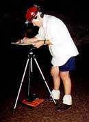 Fig. 18. Claire Cooney using a plane table and laser rangefinder at Wellington Caves.